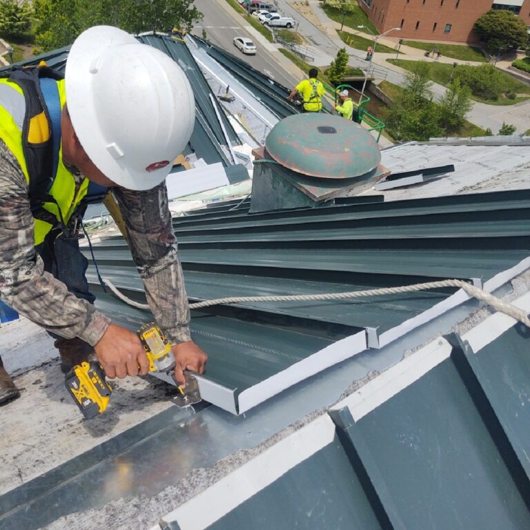 Commercial roofer working on appalachian state garwood hall roof replacement