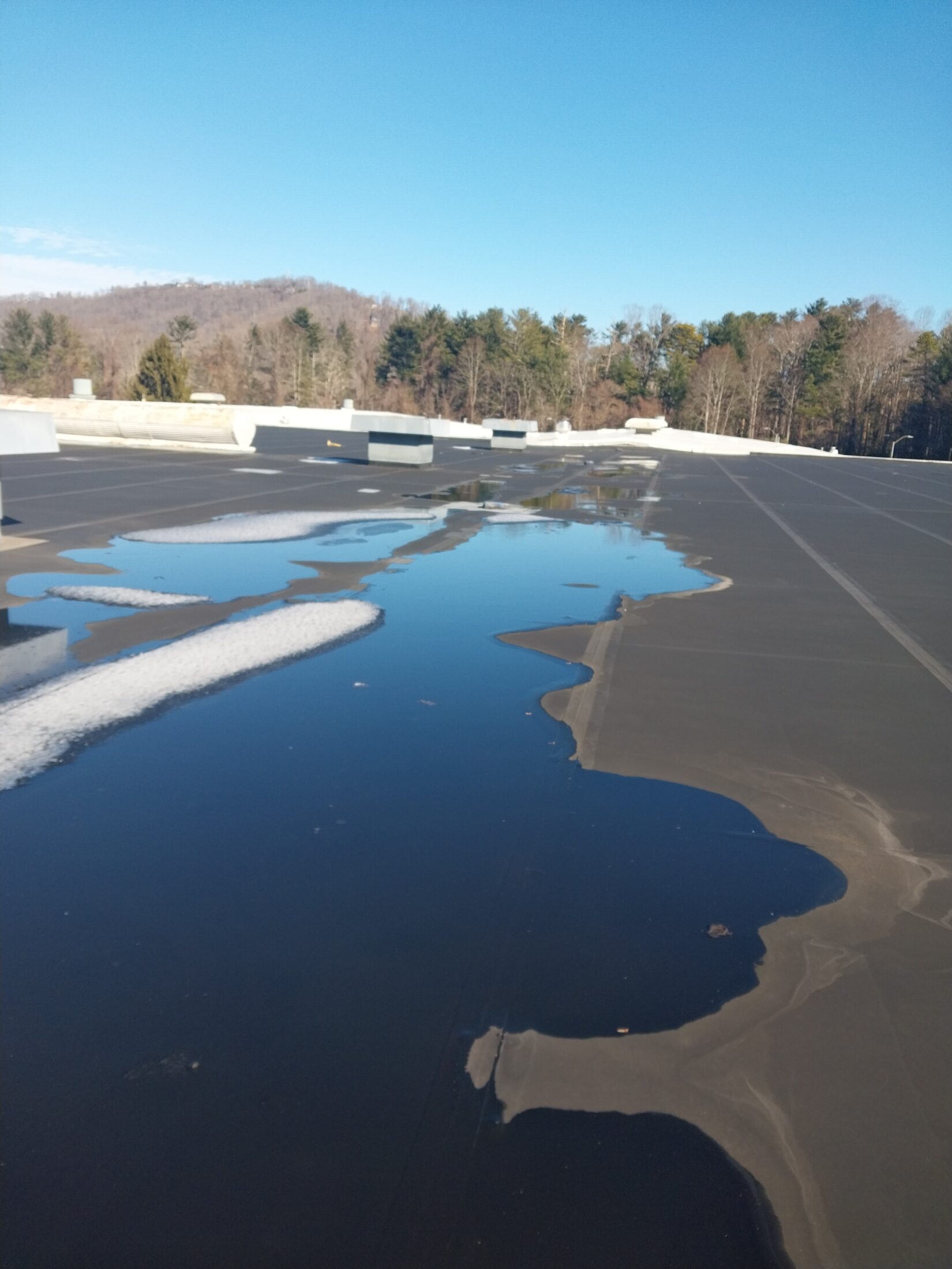 Ponding water on old EPDM industrial roof