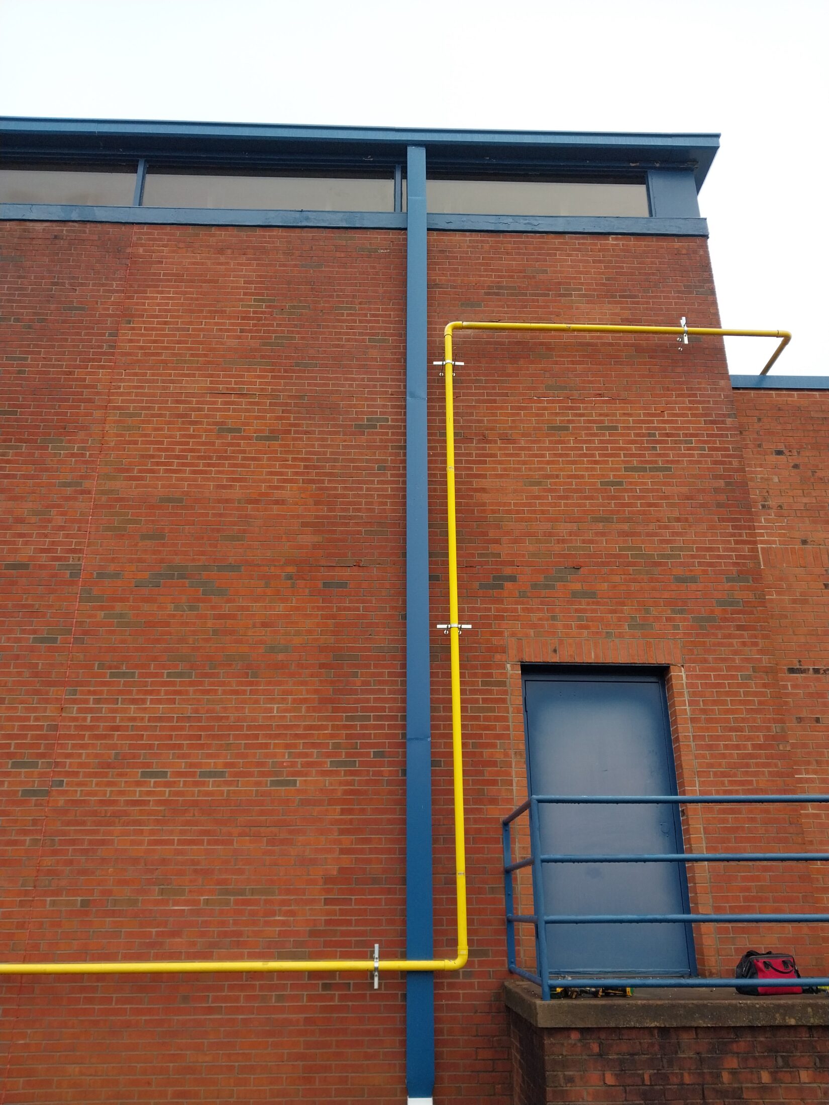 New blue metal commercial downspout