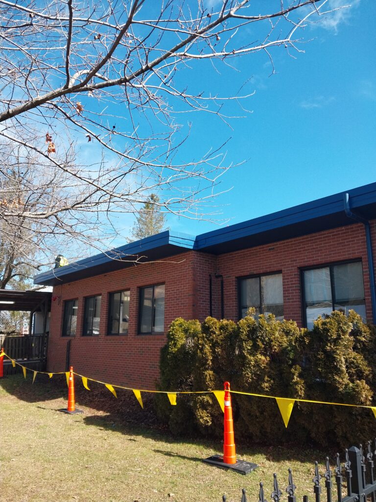 New blue metal gutters and downspouts
