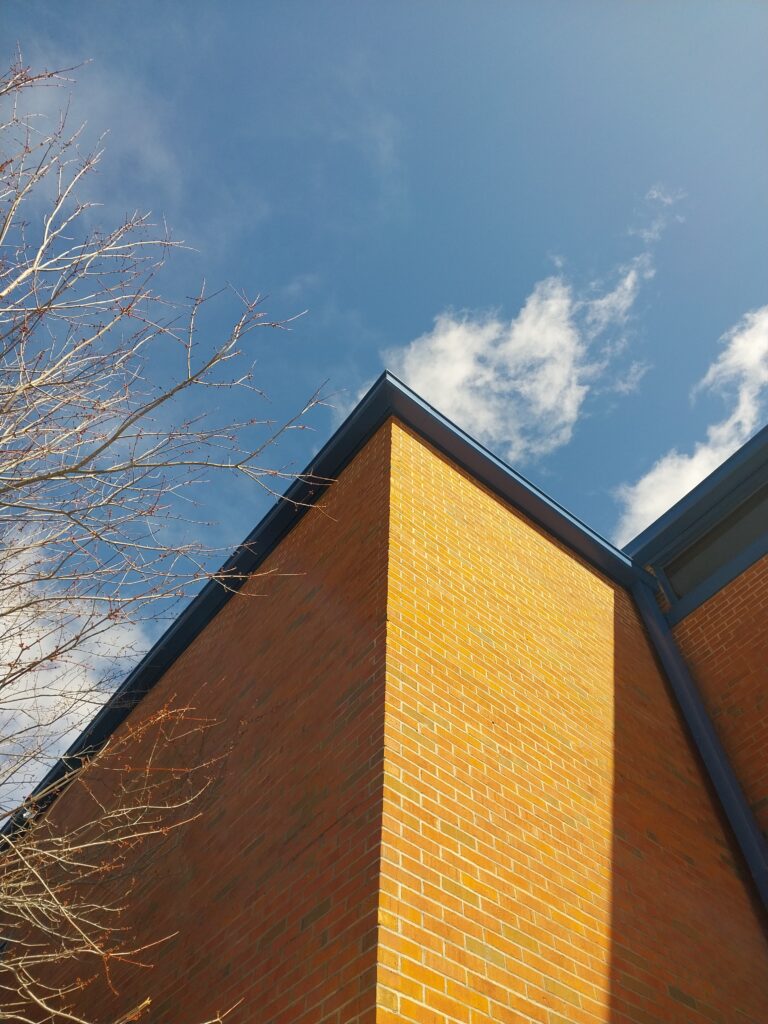 New blue gutter and downspouts for a school