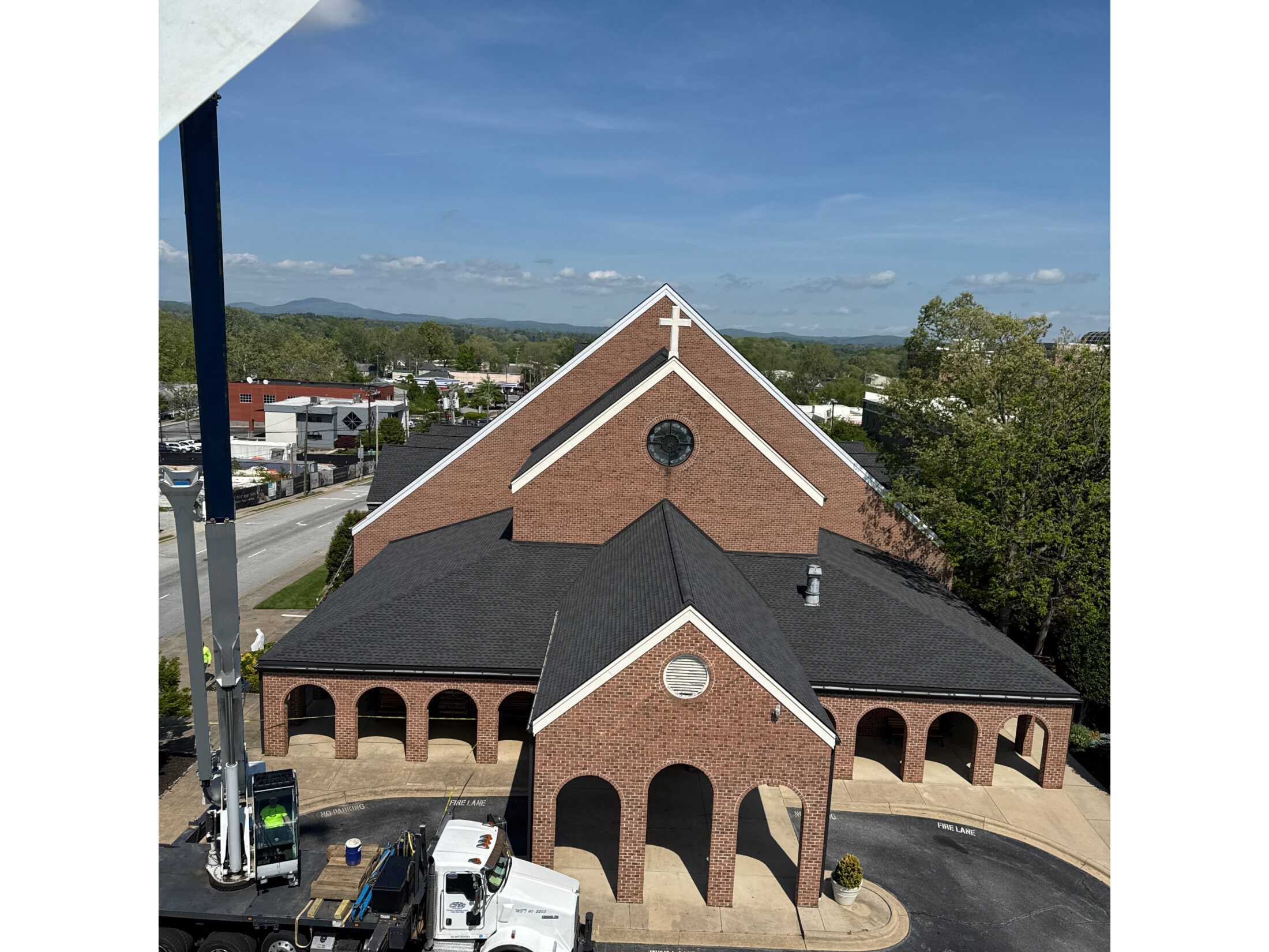 Full picture of finished metal fascia repair on a church