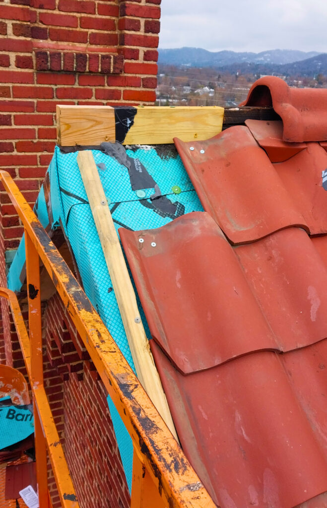 Commercial tile roof repair in process