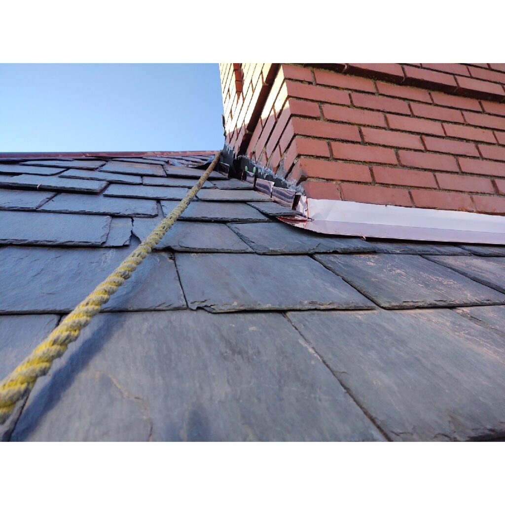 Slate roof on a historic building near the chimney