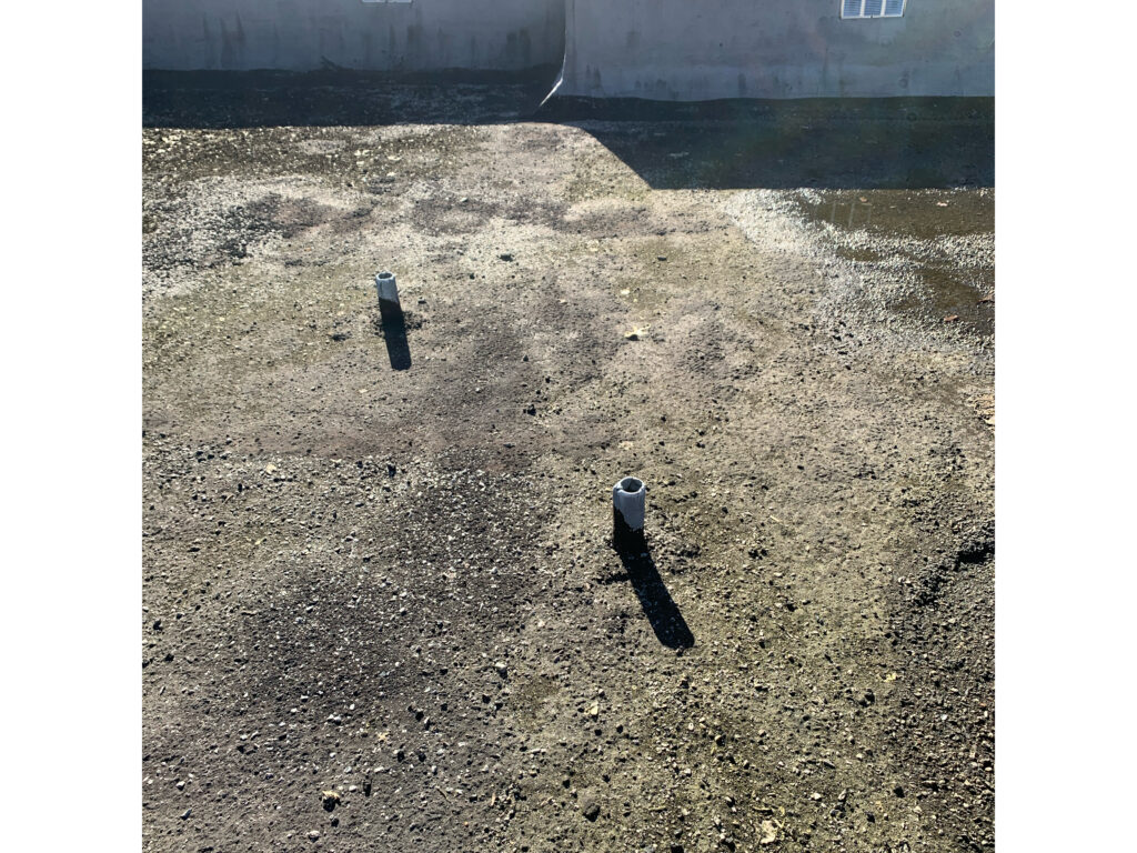 Old built up roof and failing pipe penetrations