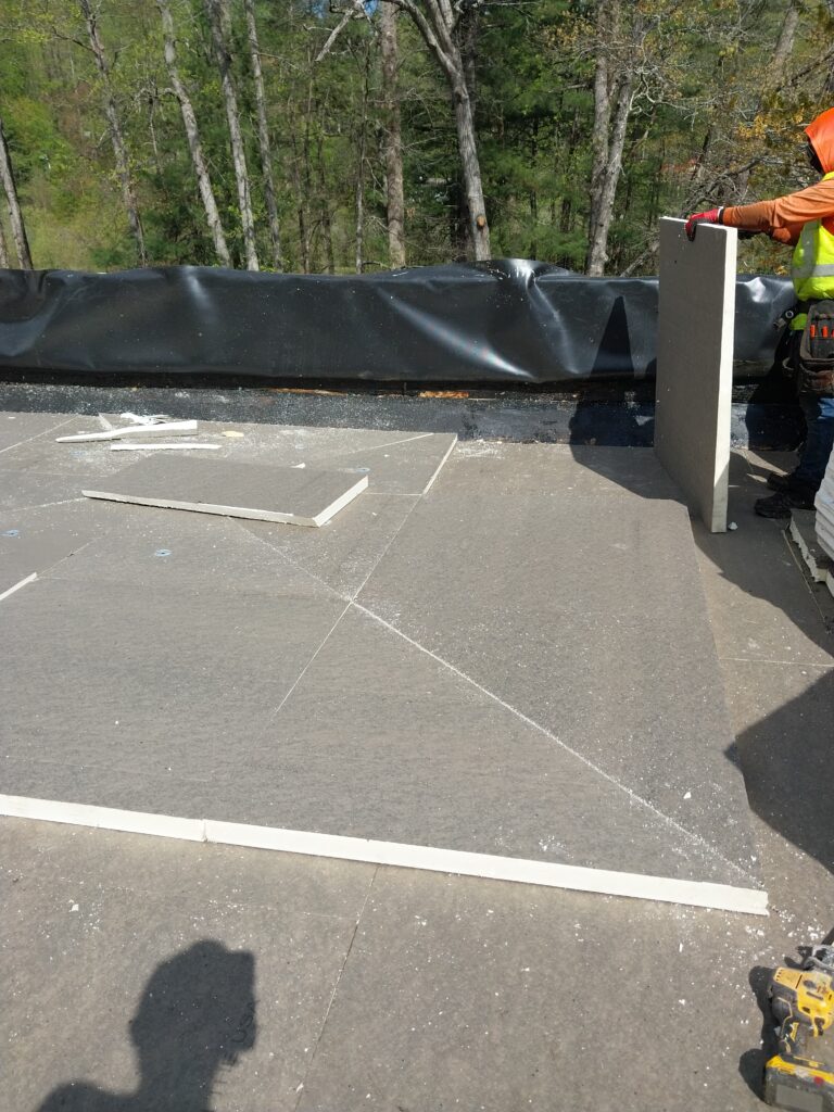 Installing a tapered insulation package on a flat roof replacement