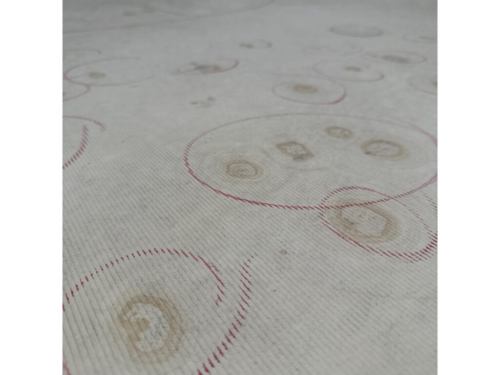 Close up of hail dents on a rubber membrane roof