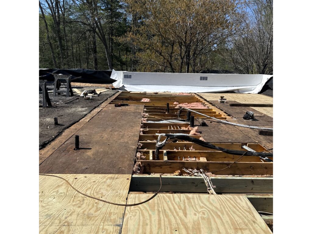 Rotten roof material is removed and ready to be replaced.