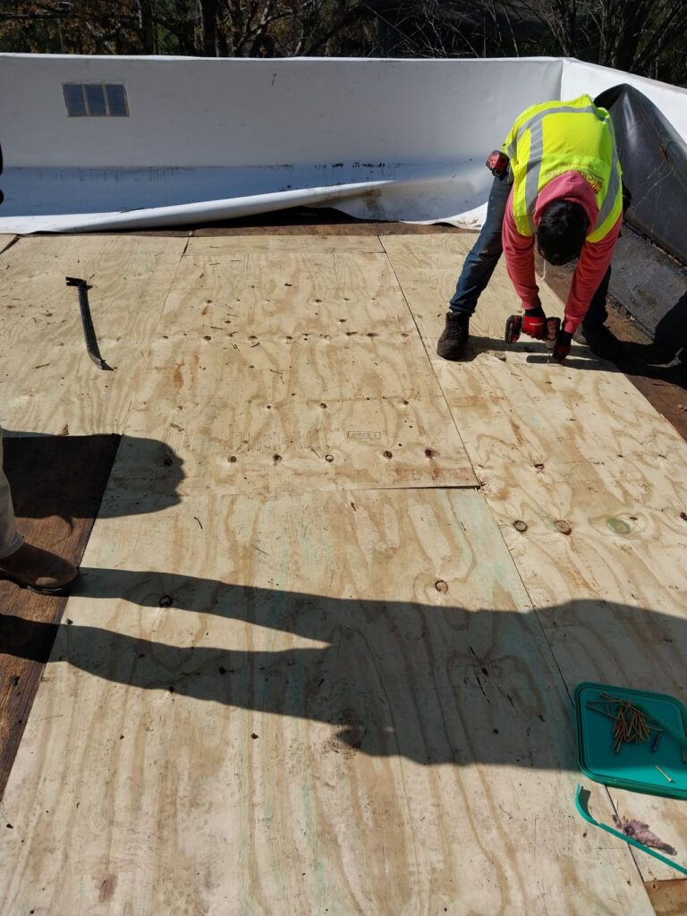New wood deck replacement on a flat roof.